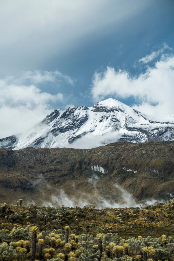 Stunning view of snow-covered peak in Manizales, Colombia with lush foreground.